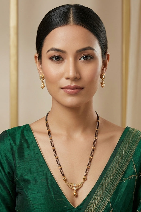 Mangalsutra In Double Chain With Kundan And Gold Pearl Attached Also Small Earrings