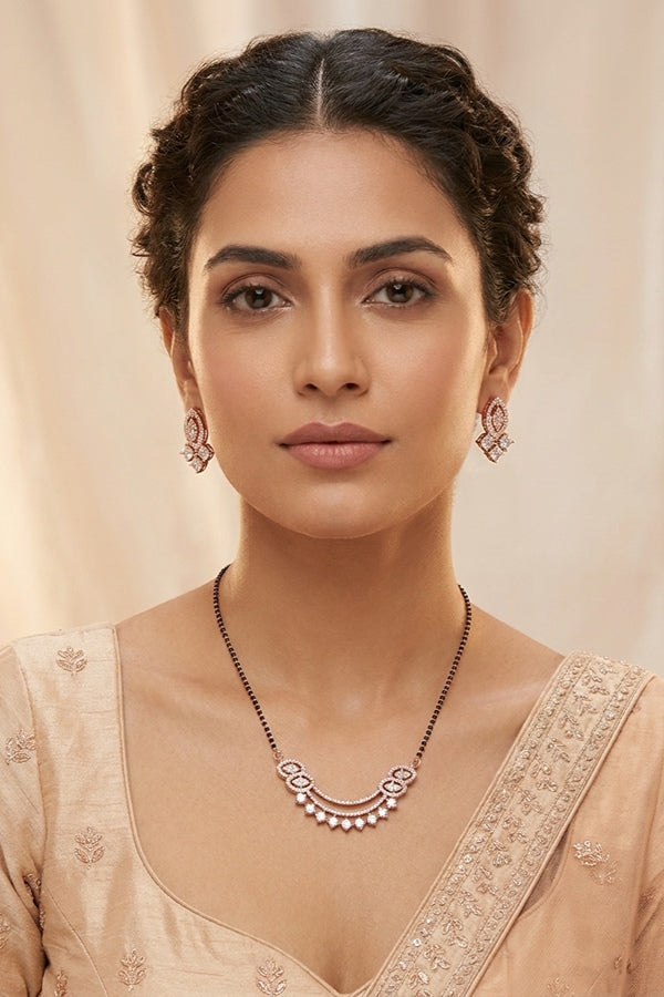Mangalsutra In Rose Gold Polish With American Diamonds And Small Matching Earrings