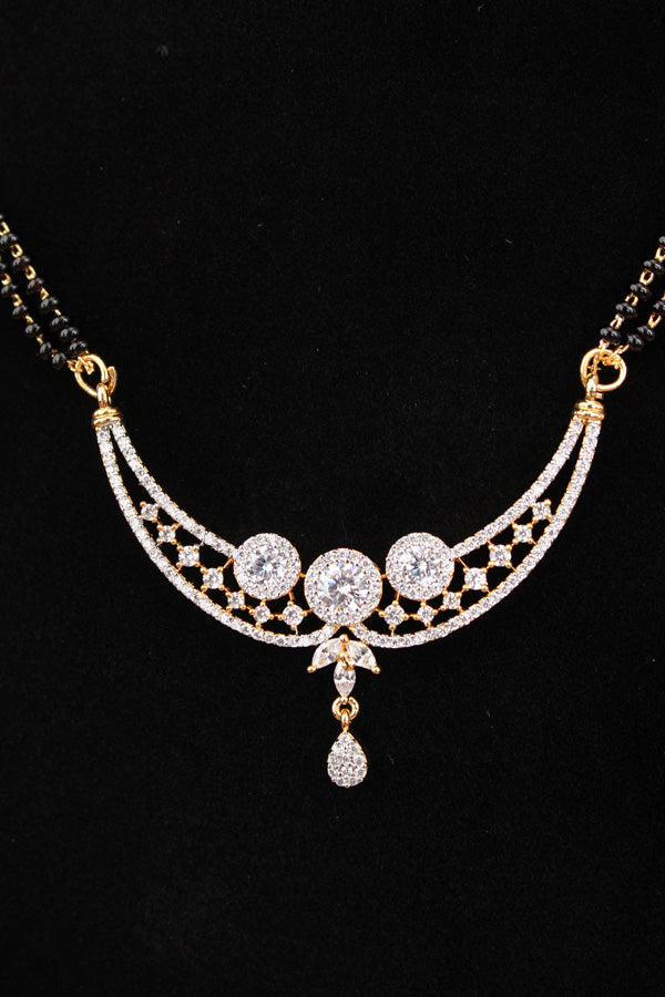 Mangalsutra With Gold Plating American Diamonds And Center Pendant With Stones Also Matching Small Studs (MS017-G)