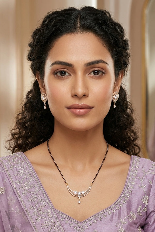 Mangalsutra With Gold Plating American Diamonds And Center Pendant With Stones Also Matching Small Studs