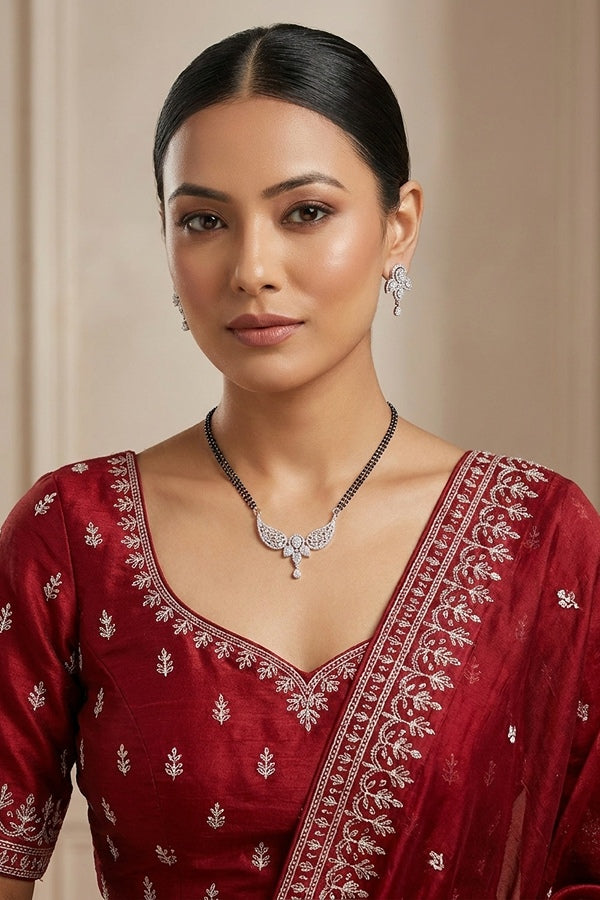Silver Polish Mangalsutra With American Diamonds And Center Pendant With Small Earrings