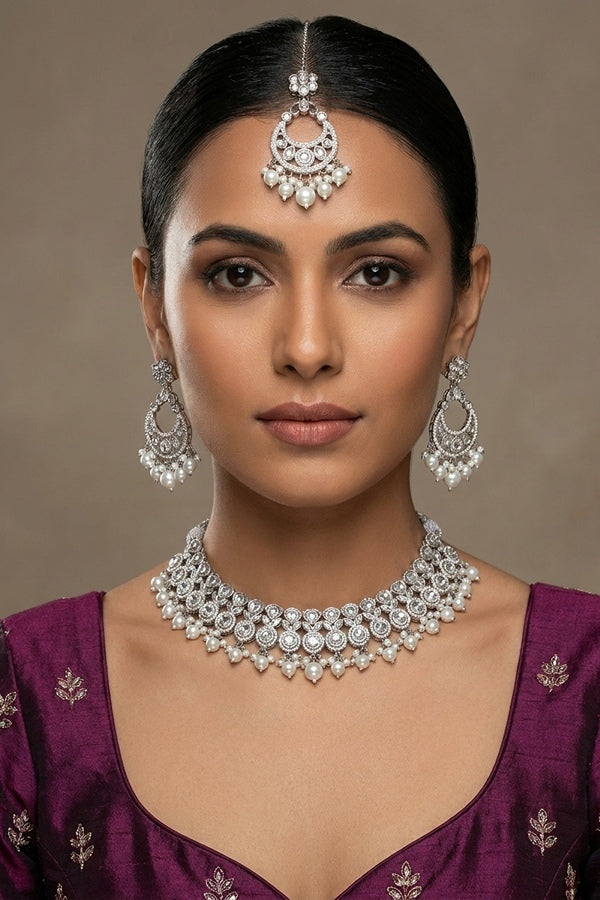 White Small And Elegant Set With White Pearls Attached Also matching earrings and tikka