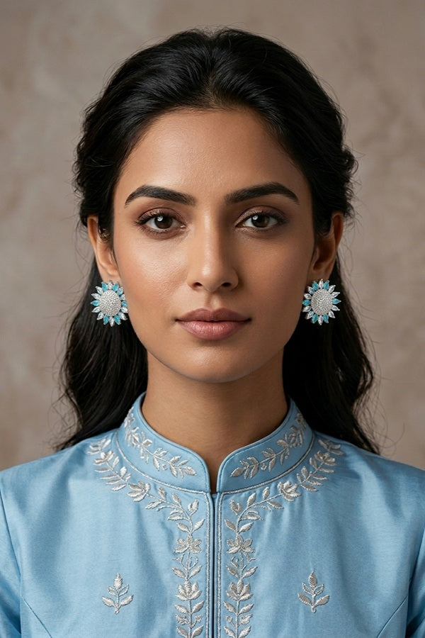 Flower Studs With Small American Diamonds In Sky Blue Colour