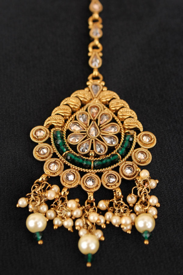 Tikka In Gold Polish With Reverse AD Stones And Green Crystal Beads (T010-G-Polki)