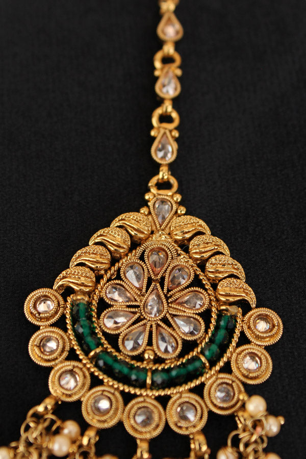 Tikka In Gold Polish With Reverse AD Stones And Green Crystal Beads (T010-G-Polki)
