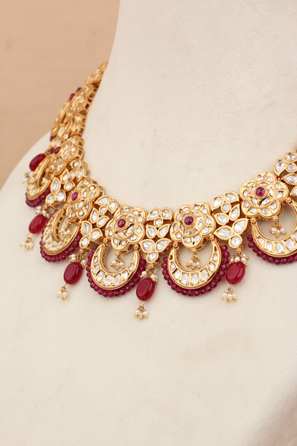 Kundan Necklace Set With Flower Design And Individual Ruby Colour Pearls Attached With Same Design Earrings (NS033RU-K)