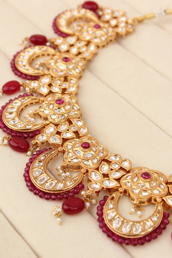 Kundan Necklace Set With Flower Design And Individual Ruby Colour Pearls Attached With Same Design Earrings (NS033RU-K)
