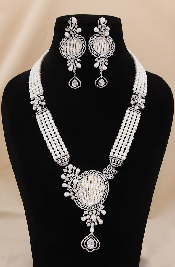 Multi Layered Pearl Statement Mala Necklace Set With A Sparkling Centerpiece And Matching Large Earrings In Silver Polish (MA001-S)