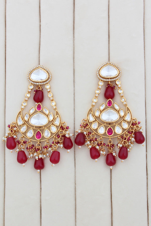 Necklace In Gold Polish With Kundan And Ruby Color Pearls Attached Also Large Earrings And Tikka(NK004-RU-K-B1)