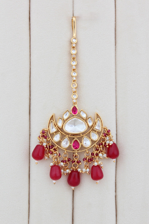Necklace In Gold Polish With Kundan And Ruby Color Pearls Attached Also Large Earrings And Tikka(NK004-RU-K-B1)