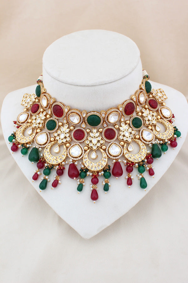 Premium Quality Kundan Set With American Diamonds And Red And Green Color Pearls Attached With Matching Earrings And Tikka(NS005-RG-K-B1)