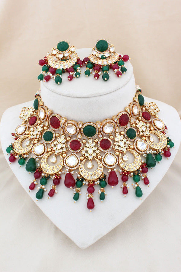 Premium Quality Kundan Set With American Diamonds And Red And Green Color Pearls Attached With Matching Earrings And Tikka(NK005-RG-K-B1)