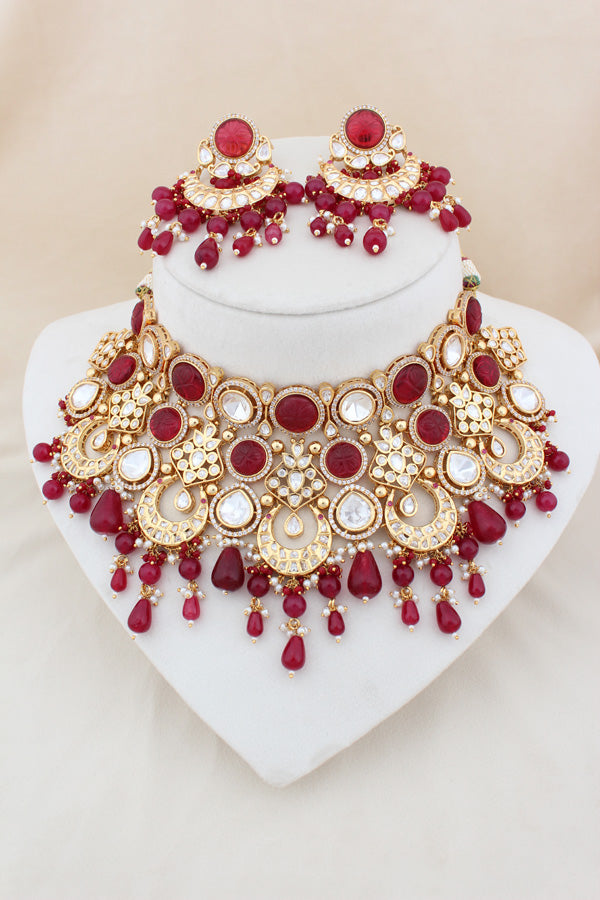 Premium Quality Kundan Set With American Diamonds And Ruby Color Pearls Attached With Matching Earrings And Tikka(NK005-RU-K-B1)