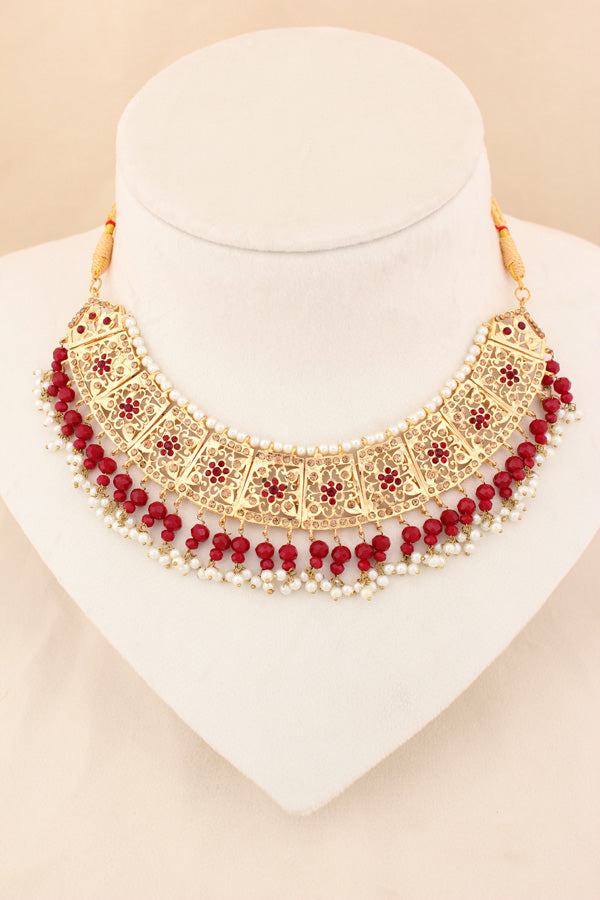 Punjabi Gold Plated Necklace Set with Red Beads Along With Earrings And Attached Saharey Also Tikka (PJNS001-R)