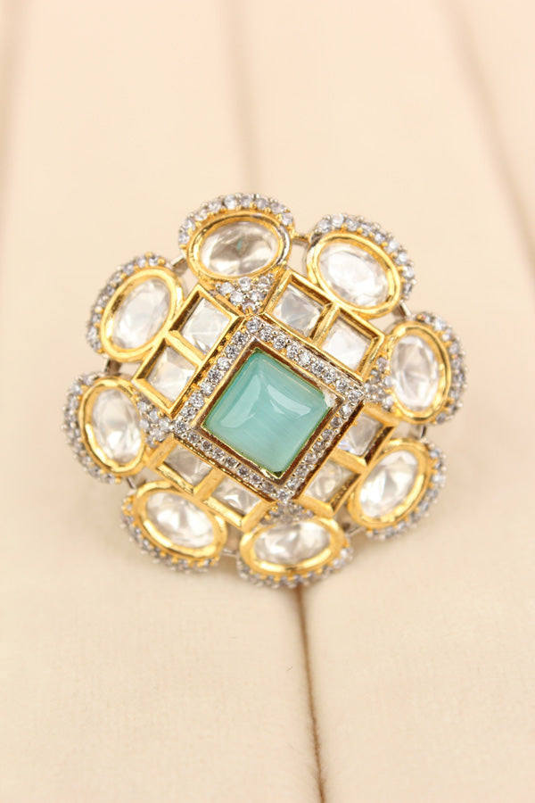 Silver Plated Quality Kundan Ring With Flower Design And Aqua Blue Colour Center Stone And Small American Diamonds (KR013-AB)