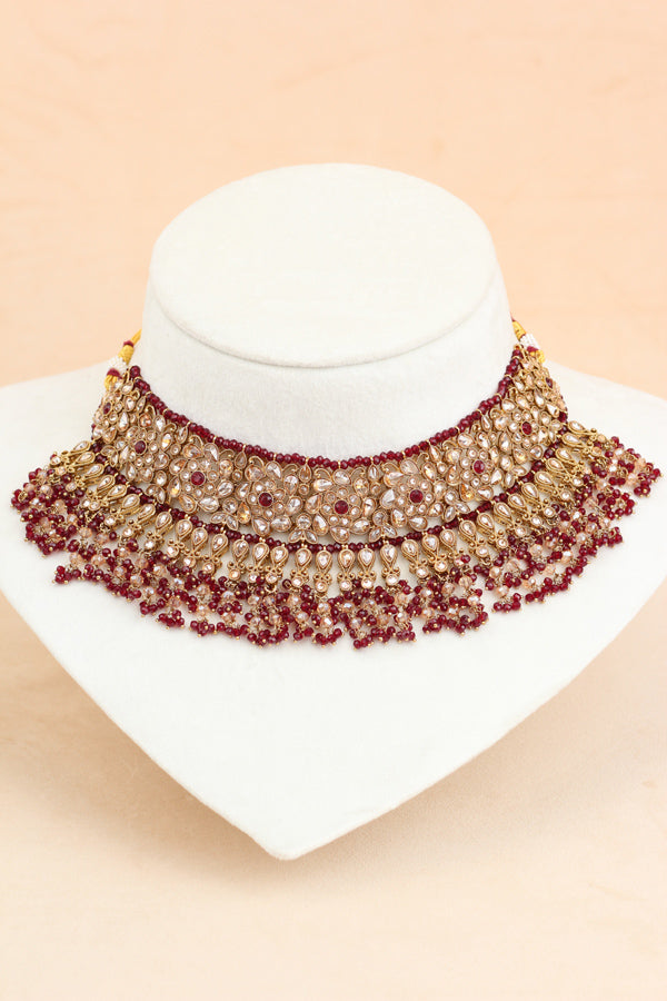 Maroon Statment Choker With Attached Pendants. Also Earrings With Jhumka And Saharey Attached And Tikka (CS026-M-Polki)