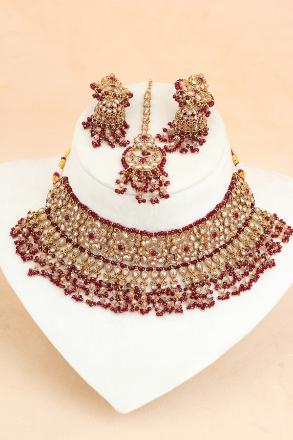 Maroon Statment Choker With Attached Pendants. Also Earrings With Jhumka And Saharey Attached And Tikka (CS026-M-Polki)