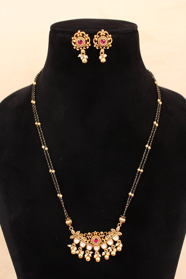 Mangalsutra With Double Chain With Kundan And Golden Beads  Attached With Ruby Colour Stones And Matching Small Earrings (MS004-RU)
