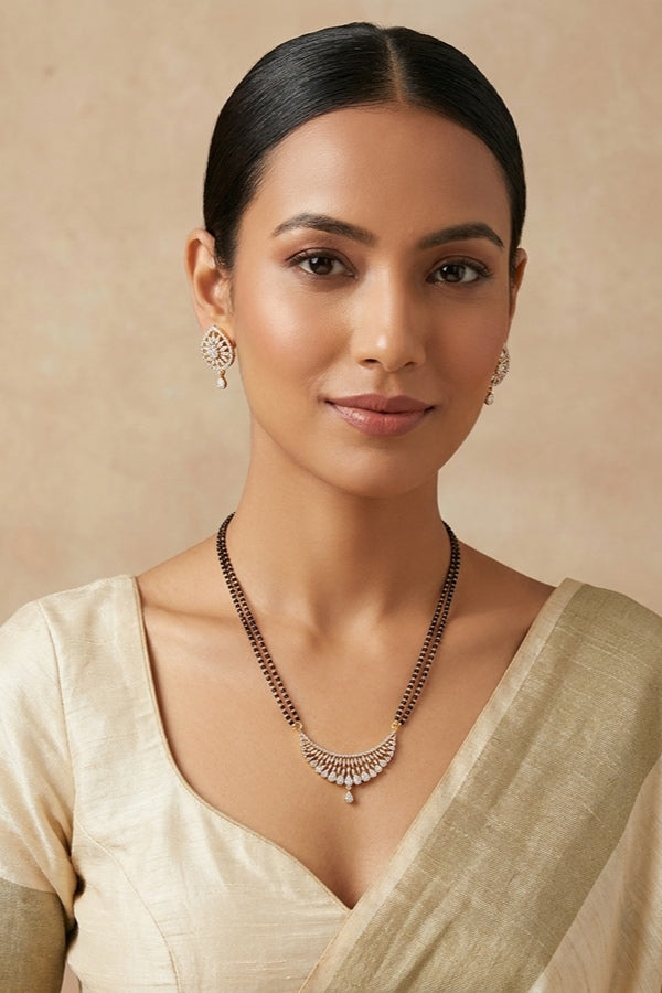 Gold Polish Mangalsutra With American Diamonds And Small Studs