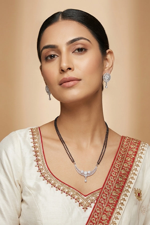 Mangalsutra With Silver Plating American Diamonds And Center Pendant With Stones Also Matching Small Studs 