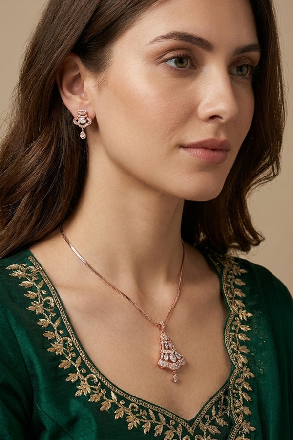 Pendant Set In Rose Gold Polish And A Small Bell Pendant And Small Matching Earrings