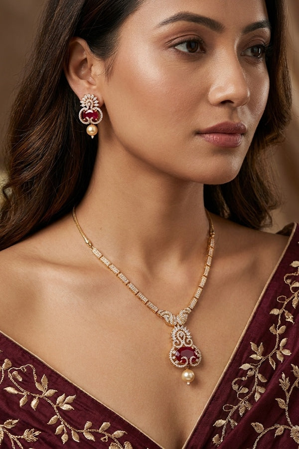 Premium Quality Gold Polish Pendant Set With American Diamonds Center Ruby Stone And Matching Earrings
