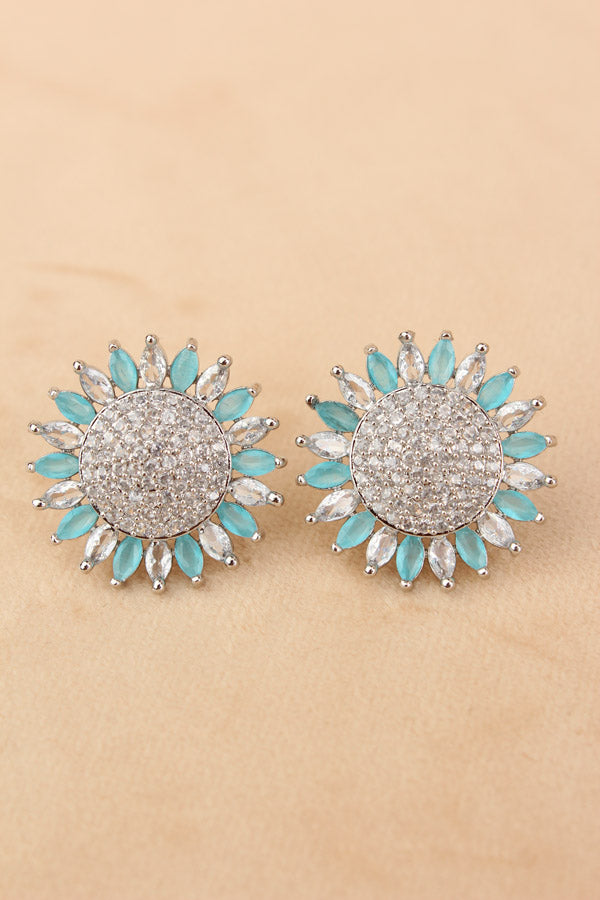 Flower Studs With Small American Diamonds In Sky Blue Colour (ST010-SB-B1)