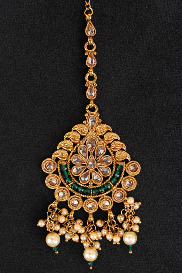 Tikka In Gold Polish With Reverse AD Stones And Green Crystal Beads (T010-G-Polki)