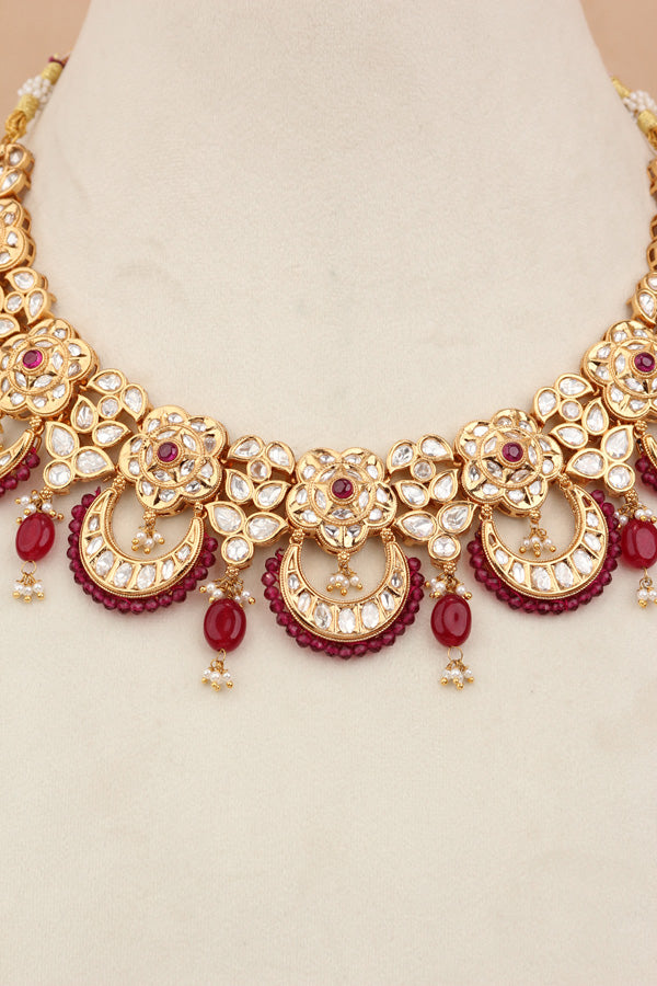 Kundan Necklace Set With Flower Design And Individual Ruby Colour Pearls Attached With Same Design Earrings  (NS033RU-K)