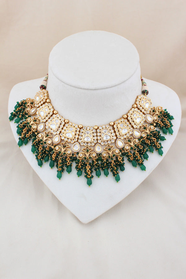 Kundan Necklace With American Diamonds And Red And Green Pearls With Earrings And Matching Tikka (NS003-G-K-B1)
