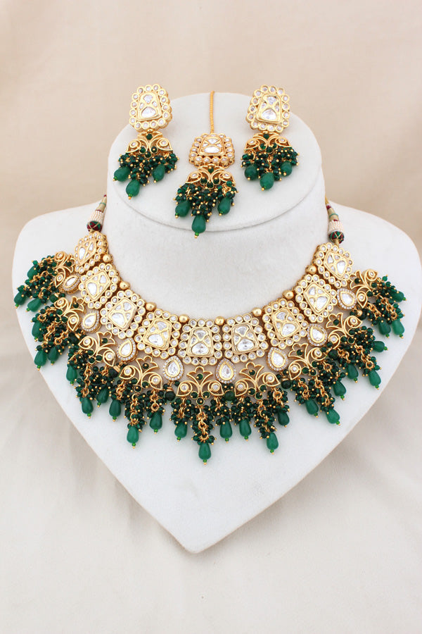 Kundan Necklace With American Diamonds And Red And Green Pearls With Earrings And Matching Tikka (NS003-G-K-B1)