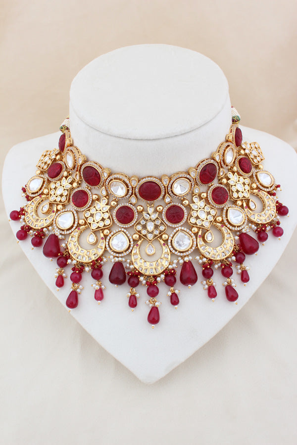 Premium Quality Kundan Set With American Diamonds And Ruby Color Pearls Attached With Matching Earrings And Tikka(NK005-RU-K-B1)