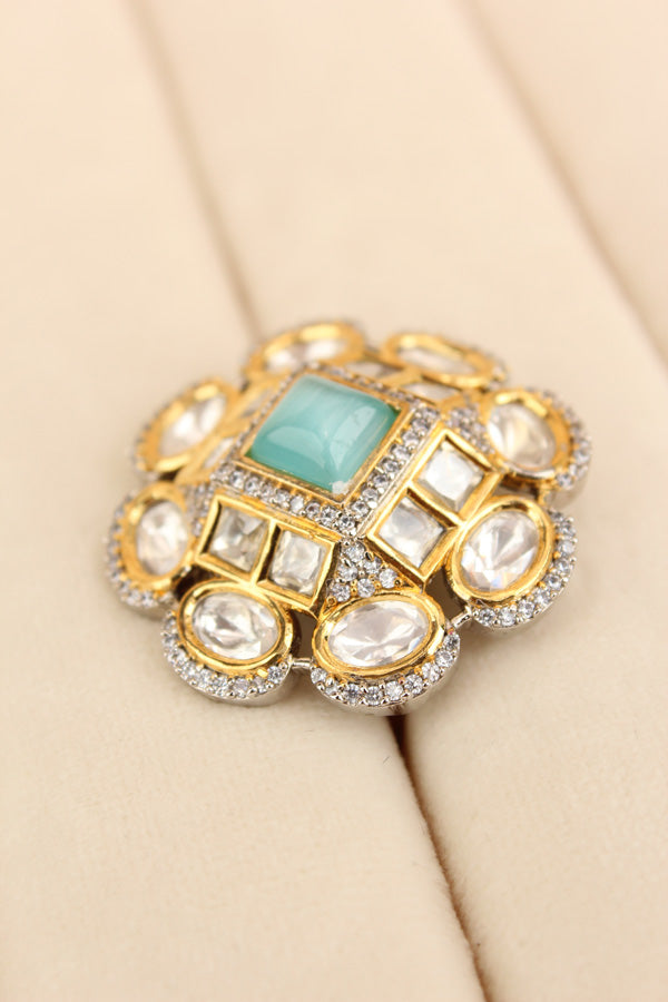 Silver Plated Quality Kundan Ring With Flower Design And Aqua Blue Colour Center Stone And Small American Diamonds (KR013-AB)